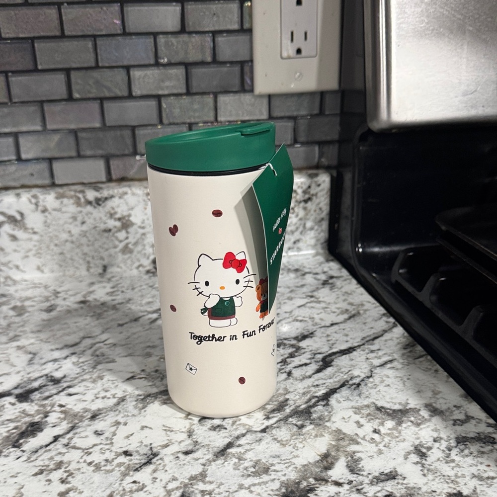 Hello Kitty Cream Travel Mug with Green Lid
